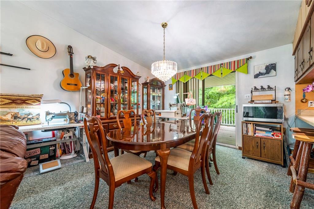 238 Greenbrier Road Acme, PA 15610 - Photo 6 of 15 a view of a dining room with furniture window and outside view