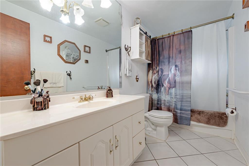 238 Greenbrier Road Acme, PA 15610 - Photo 8 of 15 a bathroom with a sink a toilet and shower