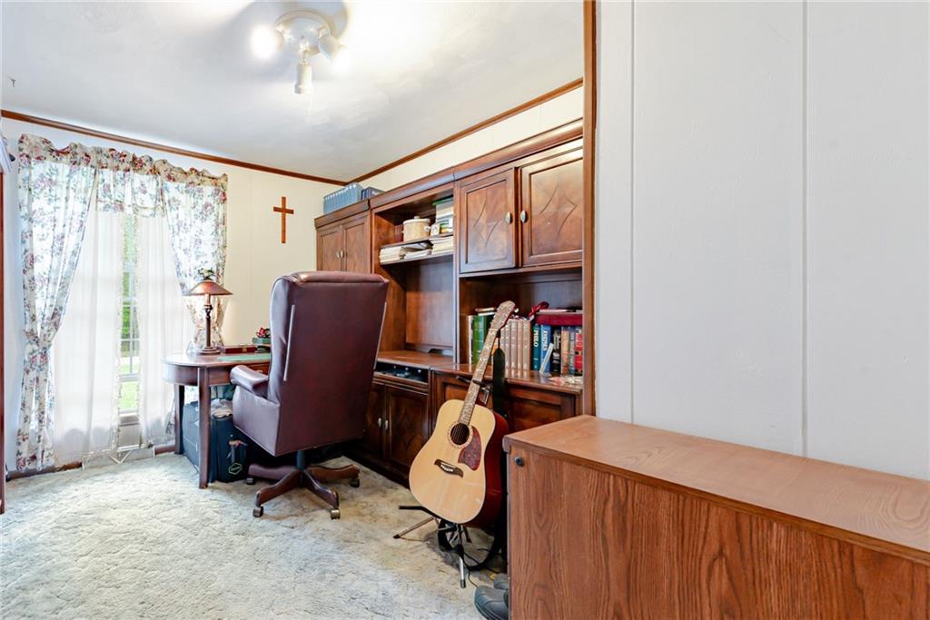 238 Greenbrier Road Acme, PA 15610 - Photo 9 of 15 a view of a workspace with furniture and a window