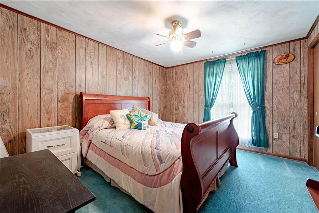 238 Greenbrier Road Acme, PA 15610 - Photo 10 of 15 a bedroom with a bed and a chandelier