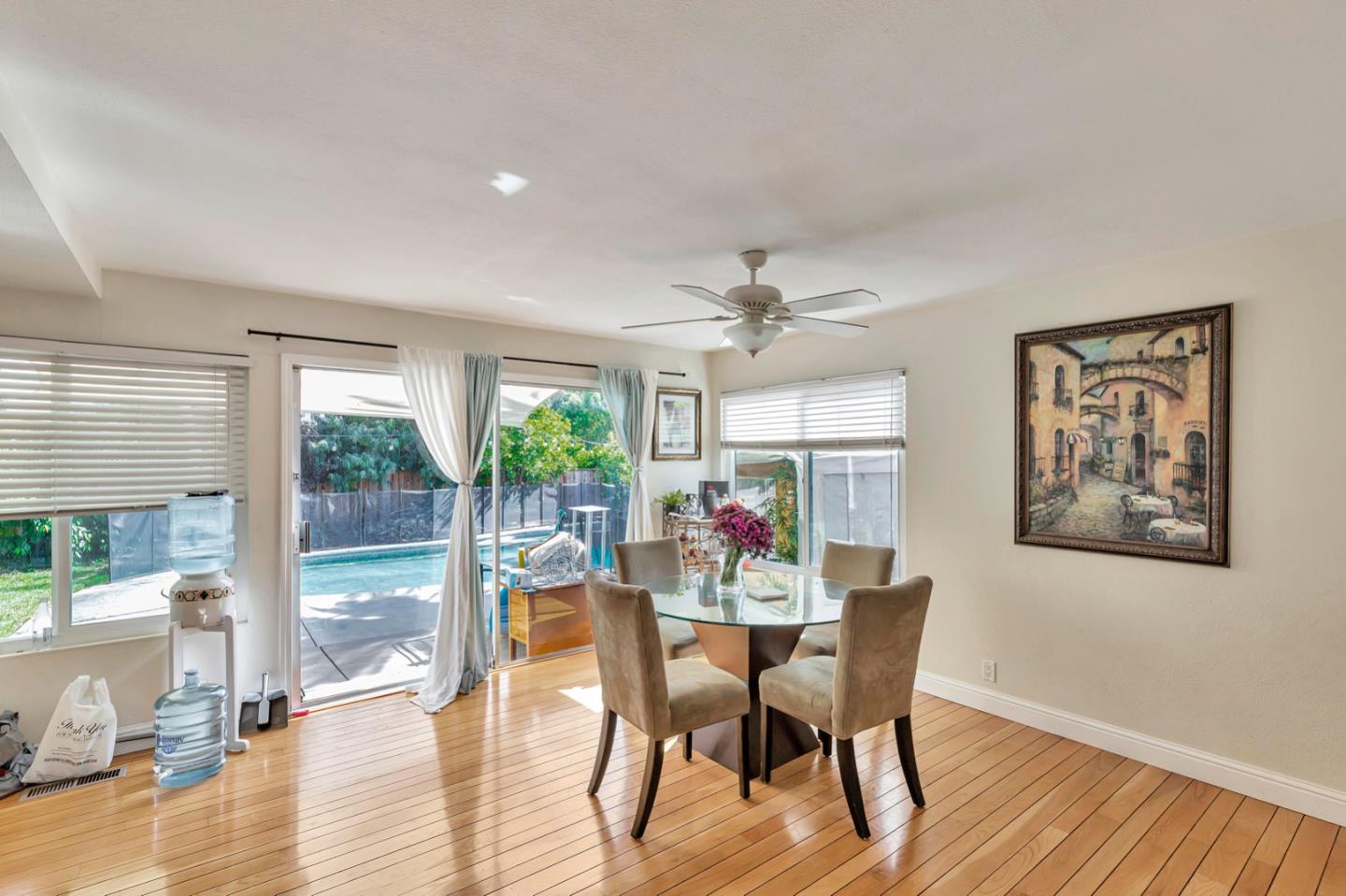 7400 Filice Drive Gilroy, CA 95020 - Photo 12 of 25 a view of a dining room with furniture window and wooden floor