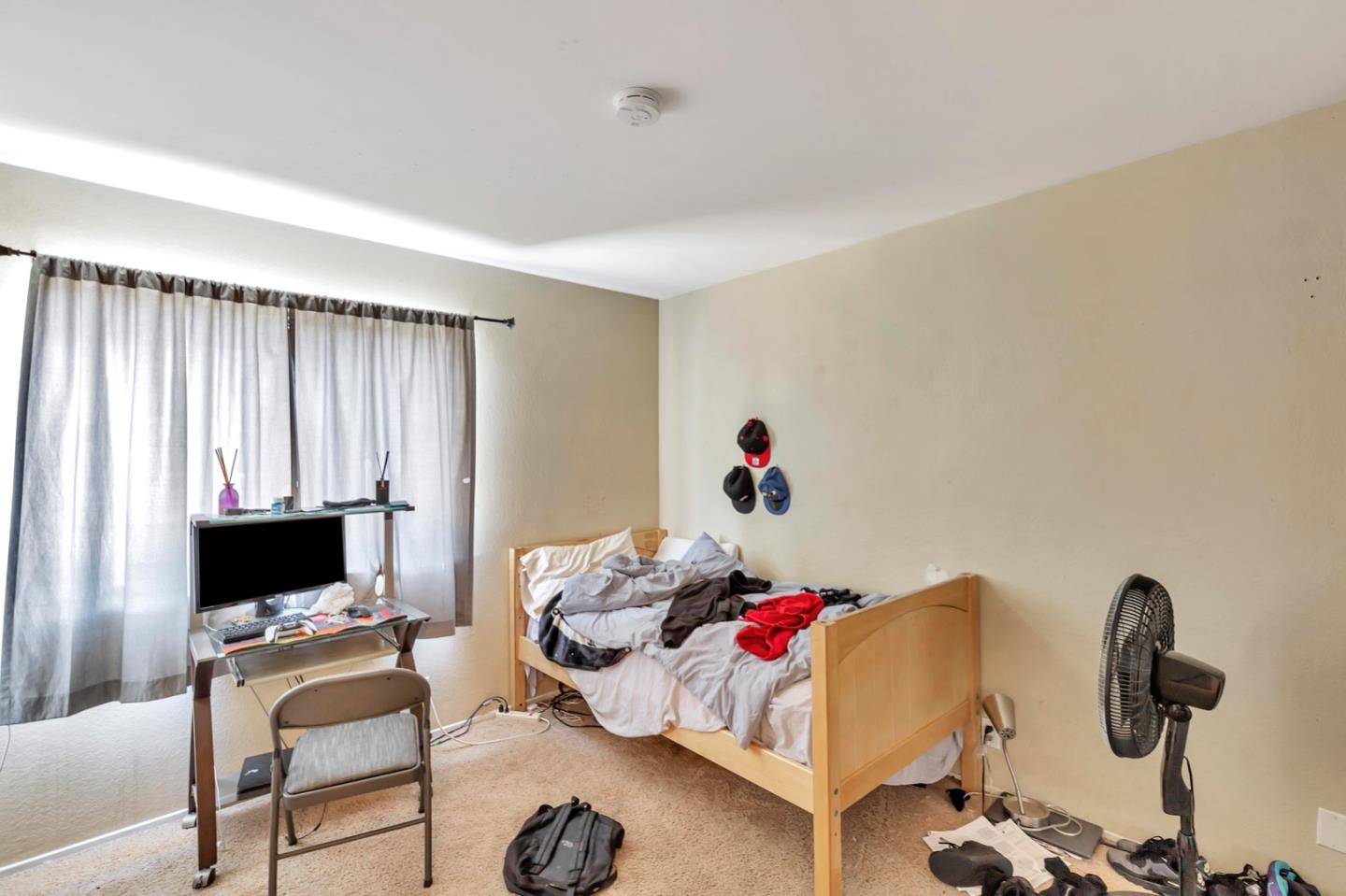 7400 Filice Drive Gilroy, CA 95020 - Photo 14 of 25 a bedroom with furniture and a flat screen tv