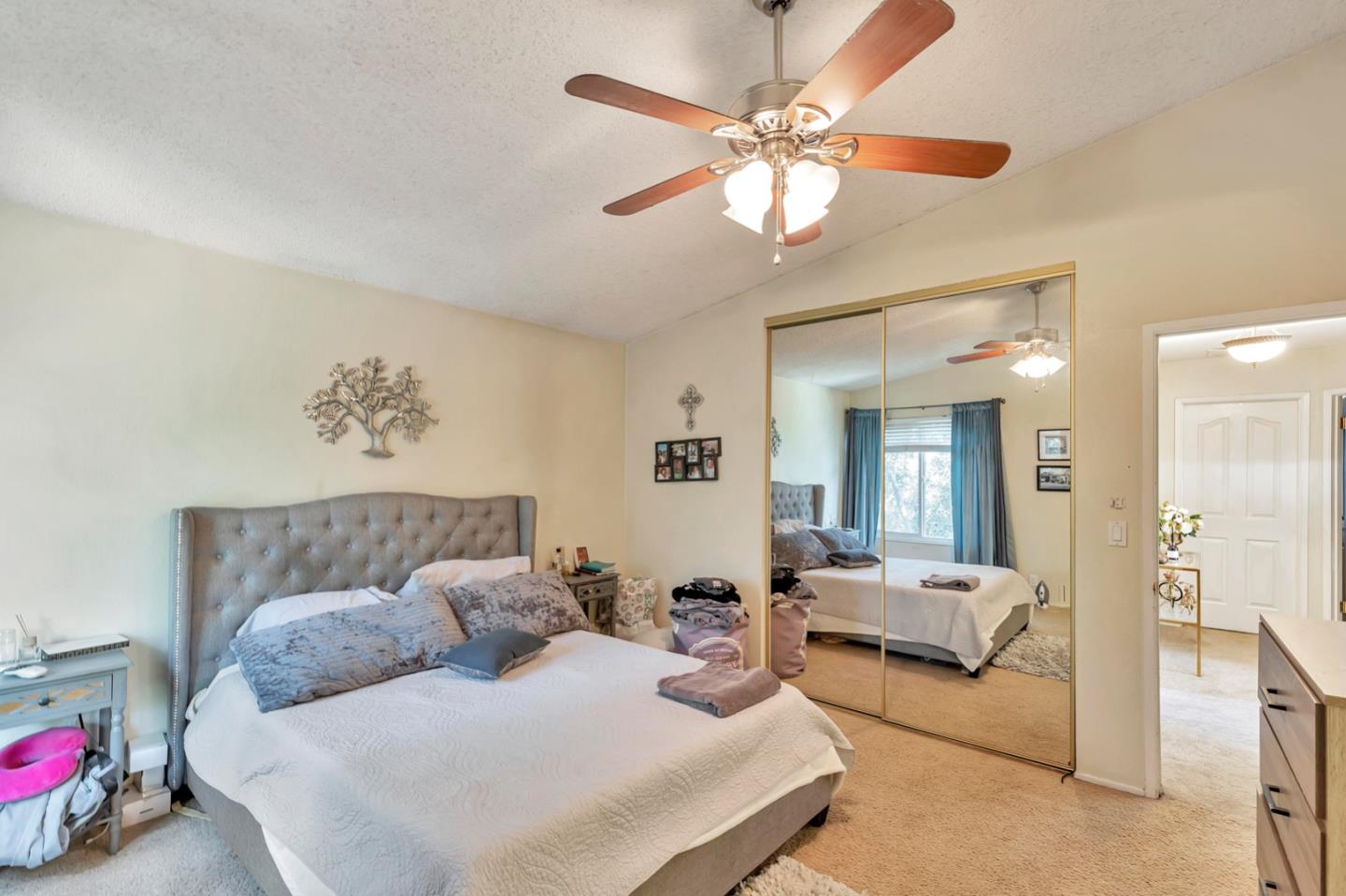 7400 Filice Drive Gilroy, CA 95020 - Photo 18 of 25 a bedroom with furniture and a chandelier