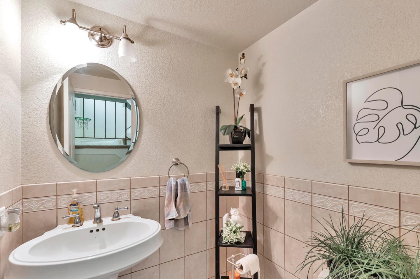 7400 Filice Drive Gilroy, CA 95020 - Photo 20 of 25 a bathroom with a sink and a mirror