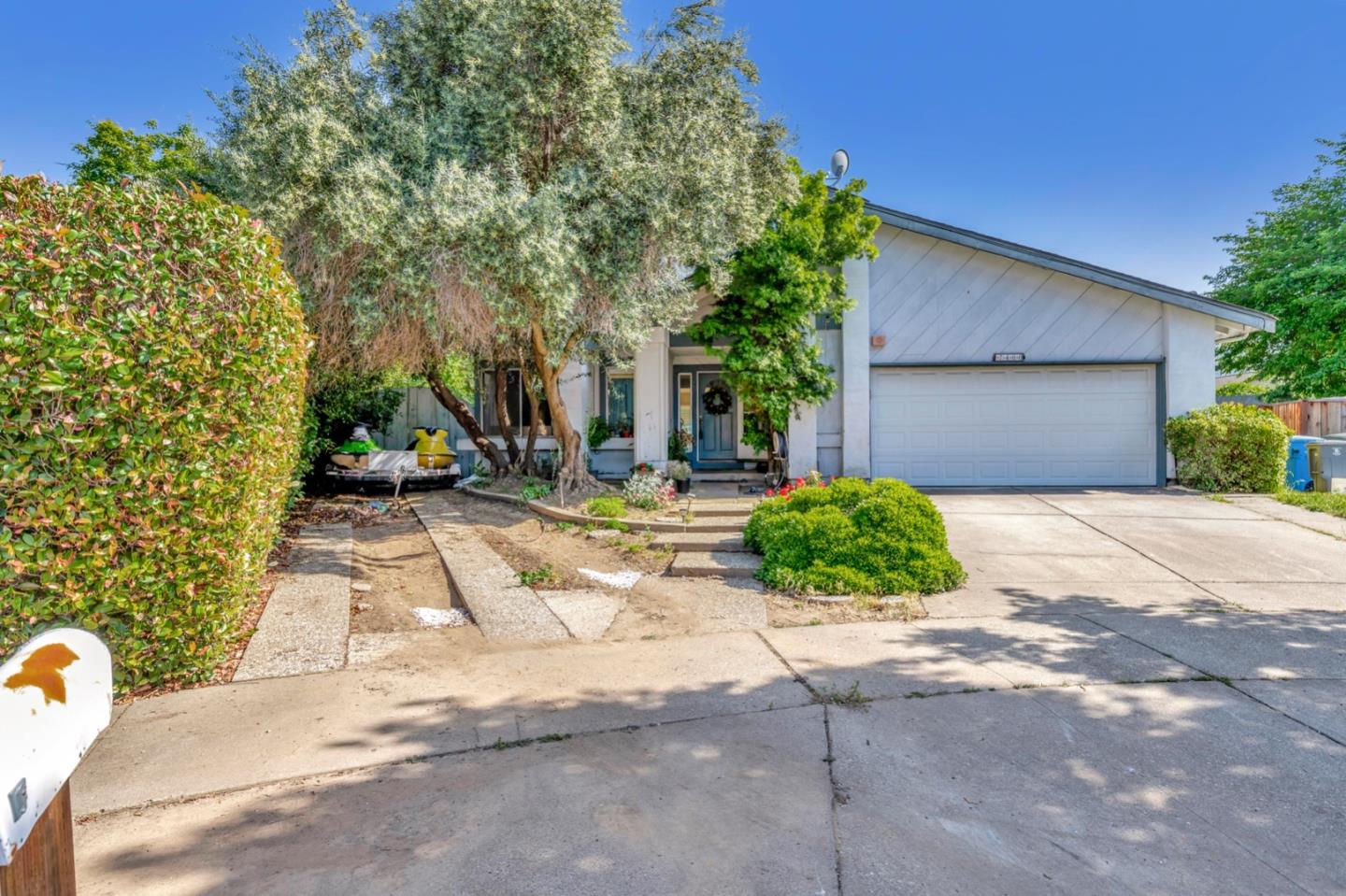 7400 Filice Drive Gilroy, CA 95020 - Photo 2 of 25 a front view of a house with garden
