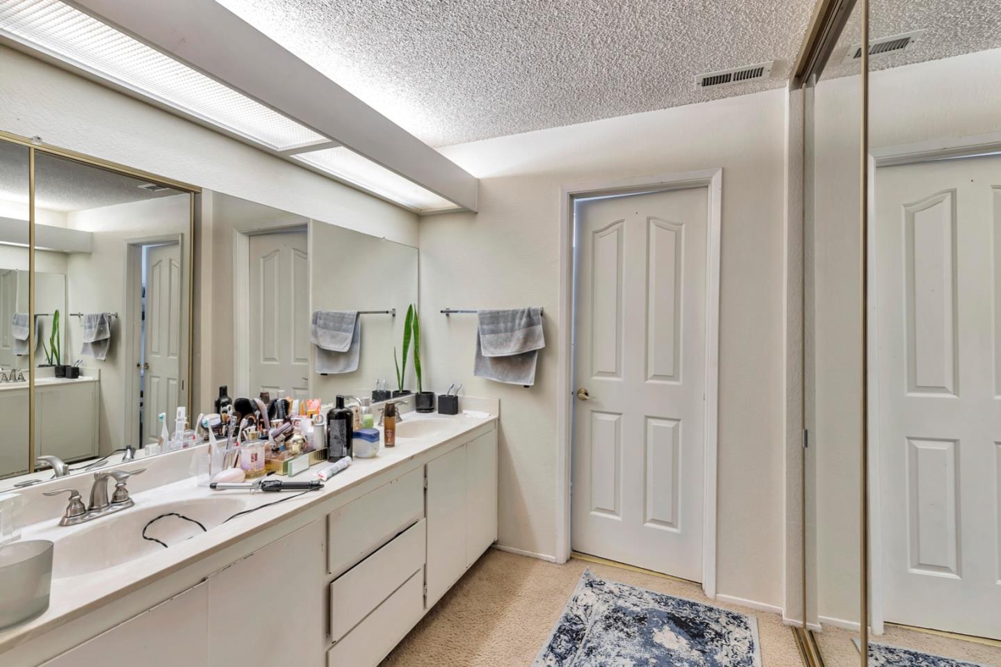 7400 Filice Drive Gilroy, CA 95020 - Photo 22 of 25 a bathroom with a sink and a mirror