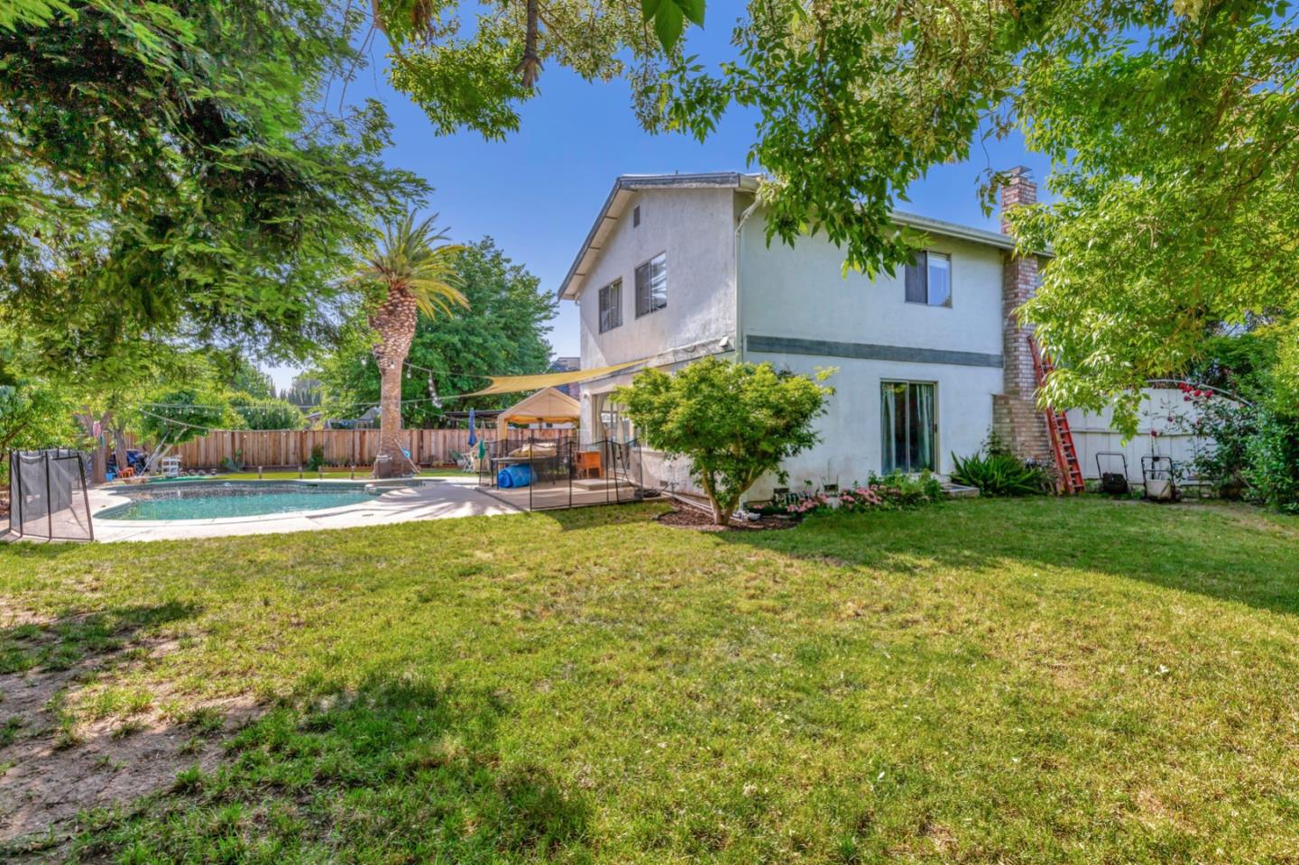7400 Filice Drive Gilroy, CA 95020 - Photo 23 of 25 a front view of house with yard and trees