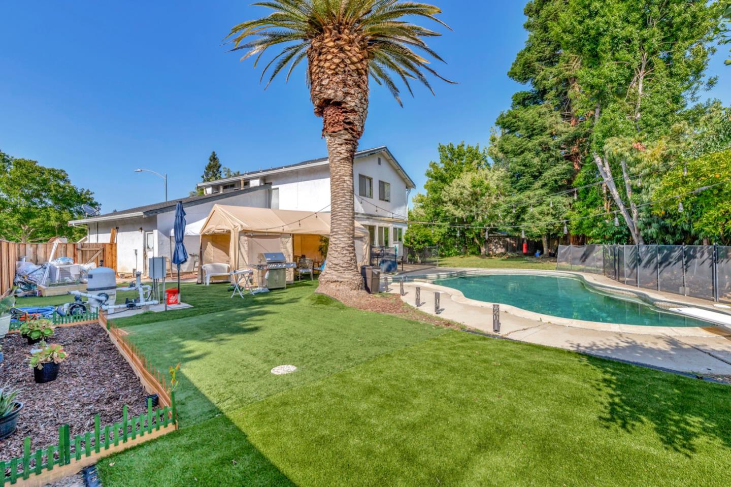 7400 Filice Drive Gilroy, CA 95020 - Photo 25 of 25 a view of a house with a big yard and palm trees