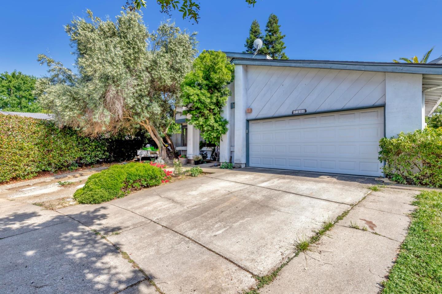 7400 Filice Drive Gilroy, CA 95020 - Photo 3 of 25 a front view of a house with a yard and garage