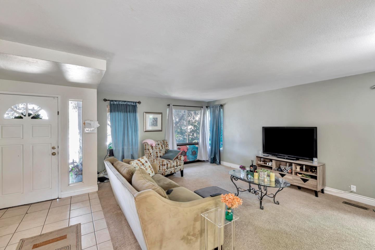 7400 Filice Drive Gilroy, CA 95020 - Photo 6 of 25 a living room with furniture and a flat screen tv