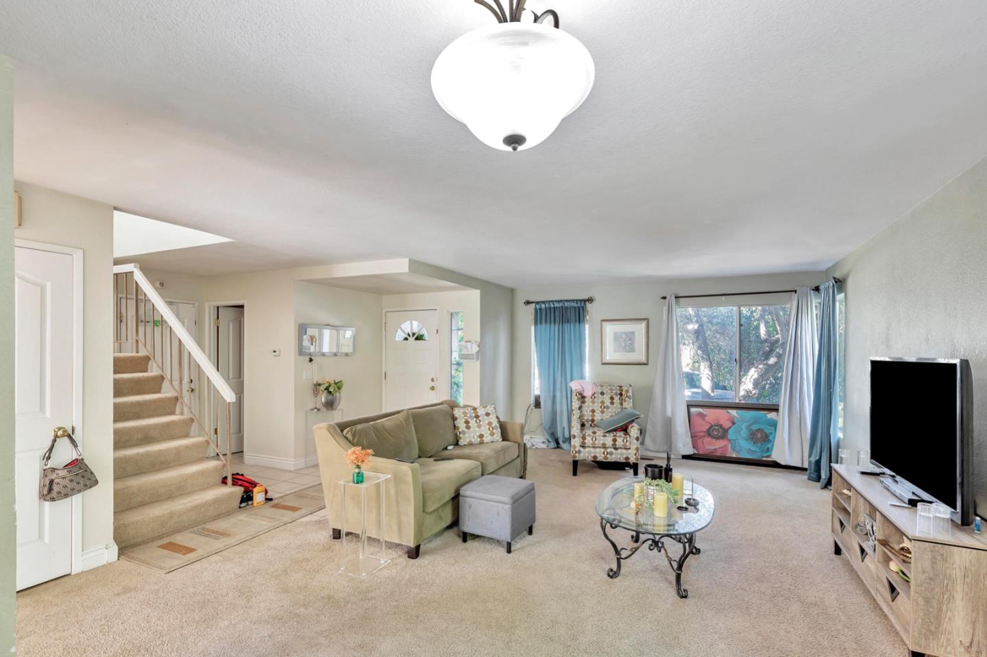 7400 Filice Drive Gilroy, CA 95020 - Photo 7 of 25 a living room with furniture and a flat screen tv