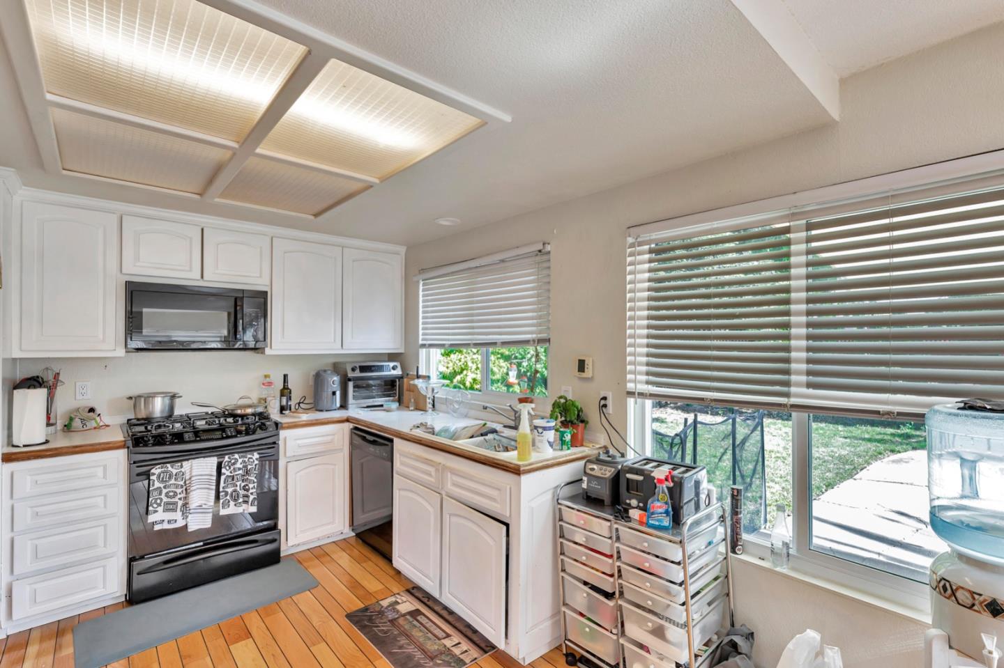 7400 Filice Drive Gilroy, CA 95020 - Photo 10 of 25 a kitchen with stainless steel appliances granite countertop a stove a sink and cabinets