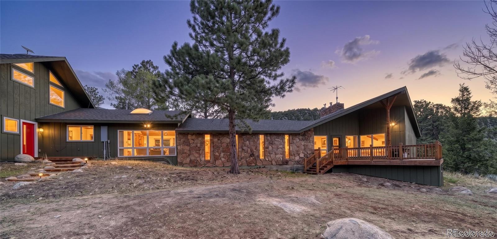 15351 Chimney Rock Road Nathrop, CO 81236 - Photo 2 of 48 a view of a house with a small yard and floor to ceiling window