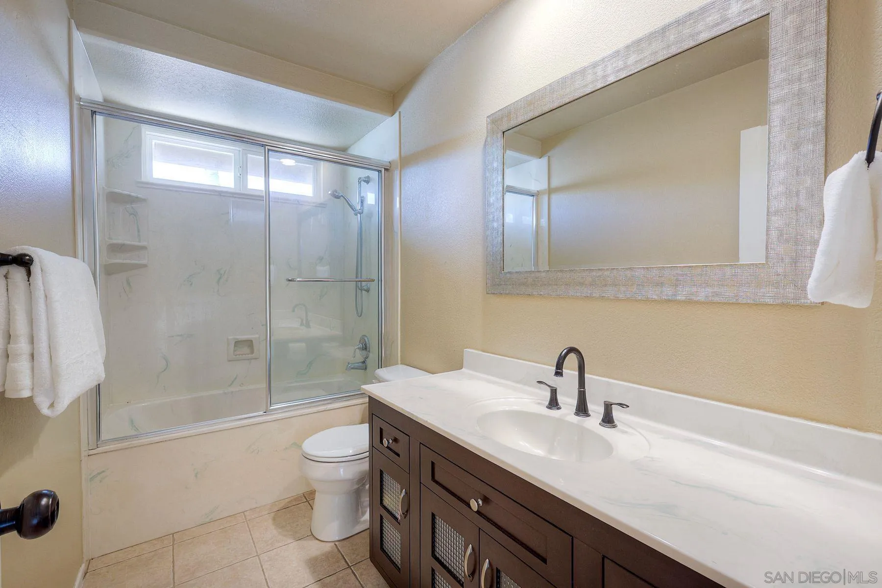 13976 Country Creek Road Poway, CA 92064 - Photo 24 of 40 a bathroom with a double vanity sink toilet and shower