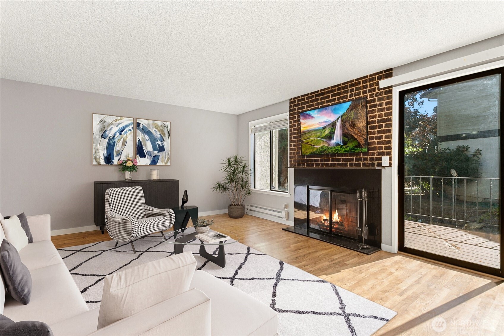 1802 Maple Lane, Unit A5 Kent, WA 98030 - Photo 1 of 27 a living room with furniture a flat screen tv and a floor to ceiling window
