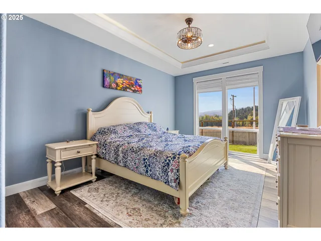 a bedroom with a bed and a view of kitchen