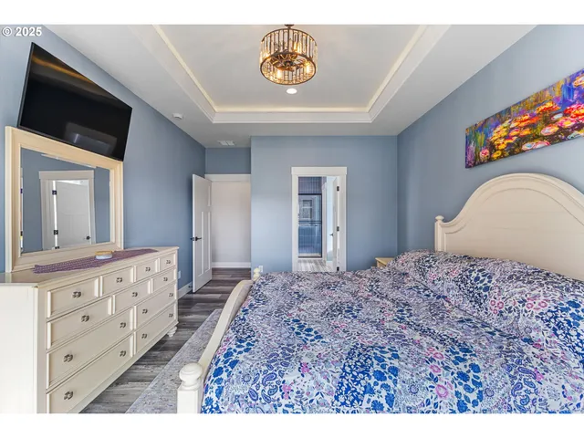 a bedroom with a bed and a dresser in it