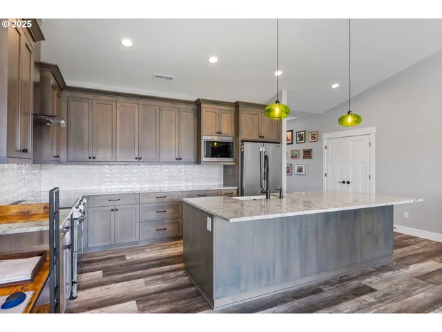 a kitchen that has a lot of cabinets in it