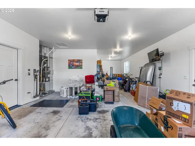 a living room with lots of furniture and a wooden floor