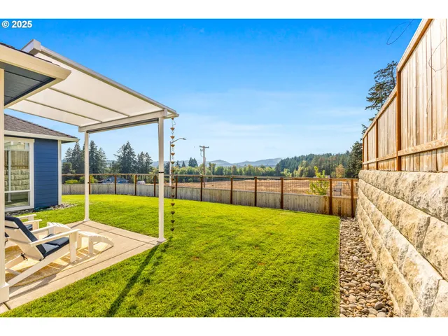 a view of a backyard with swimming pool