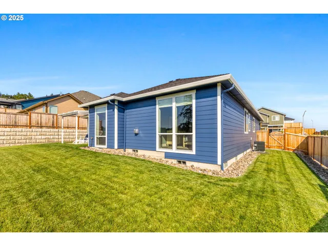 a view of a backyard of the house