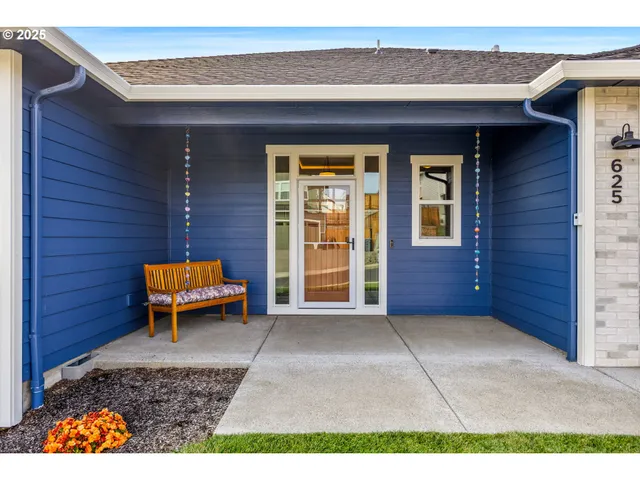 a backyard of a house with outdoor seating