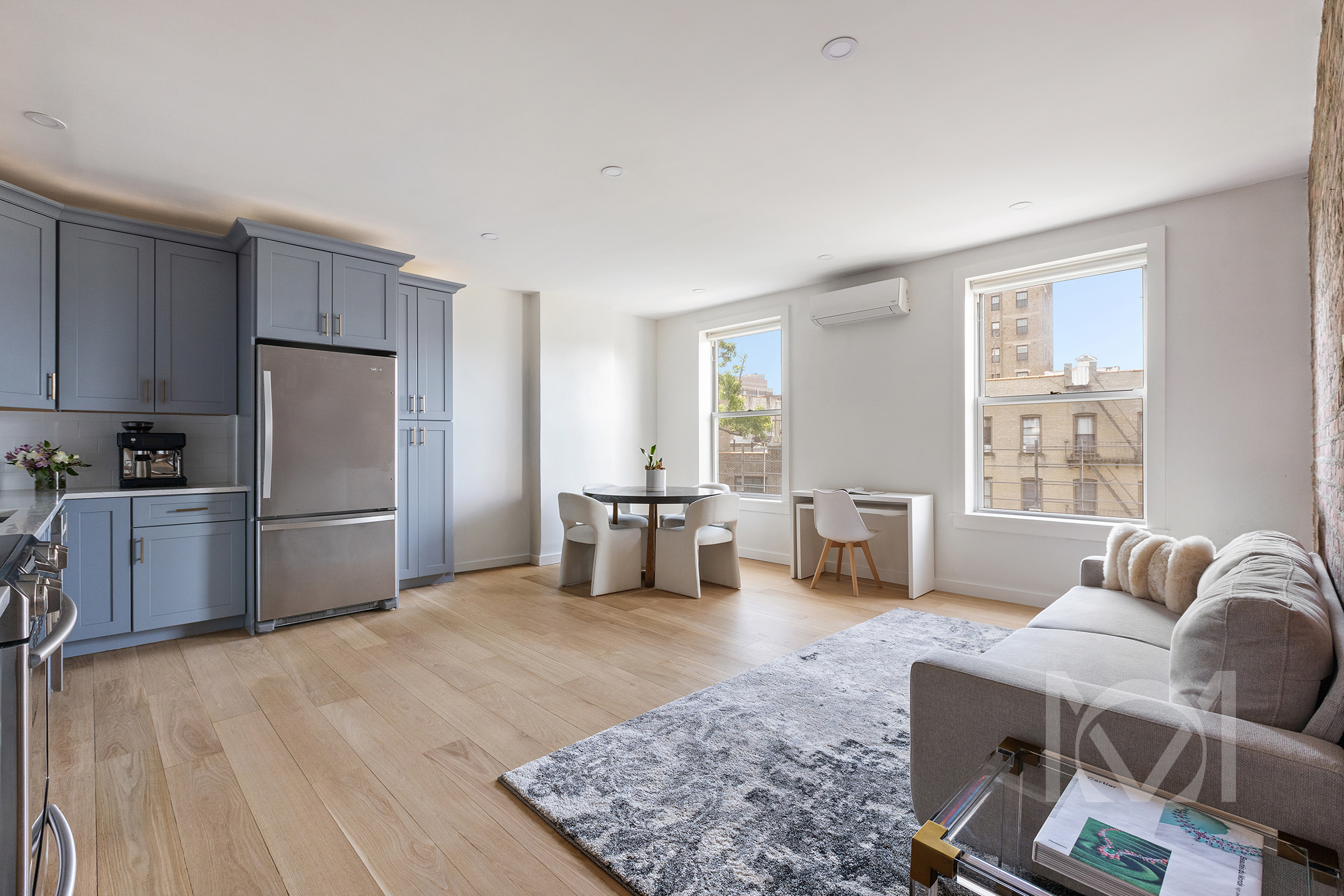 132 Remsen Street, Unit 12 Brooklyn, NY 11201 - Photo 1 of 8 a kitchen with stainless steel appliances wooden floor and a refrigerator