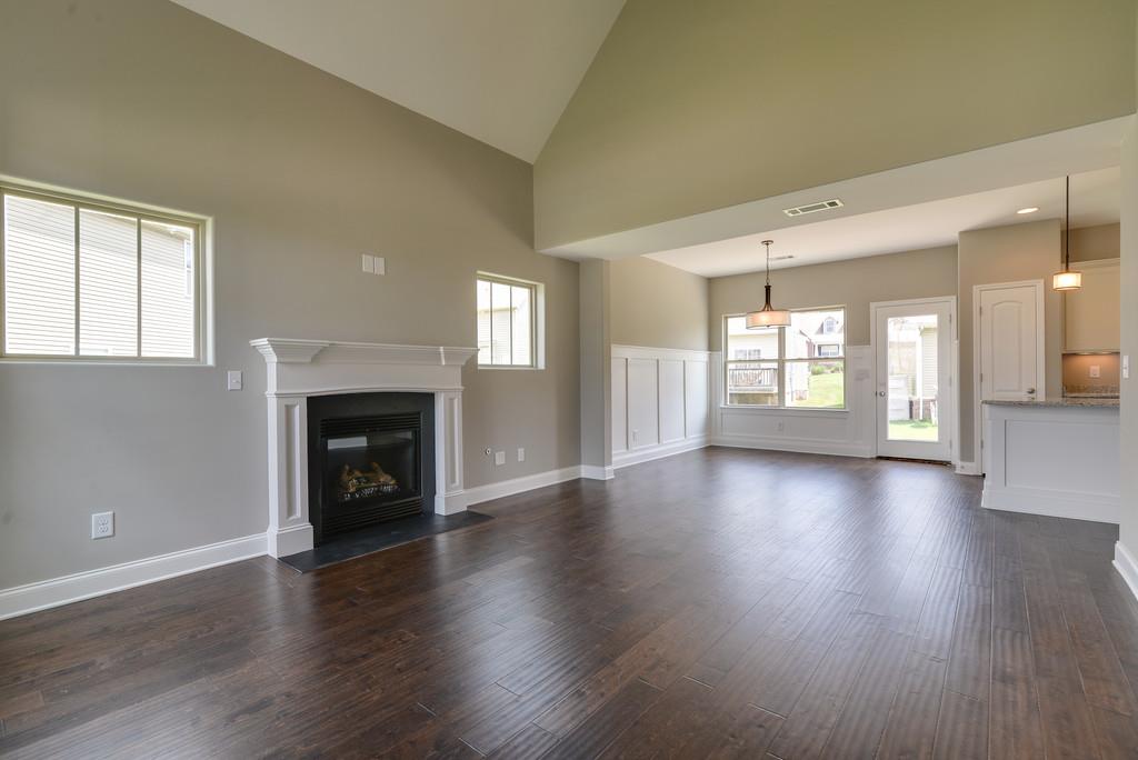 3003 Wesley Road Spring Hill, TN 37174 - Photo 3 of 16 Fireplace and open Kitchen and dining to Great room
