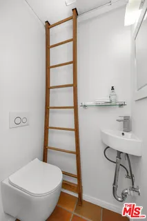 a bathroom with a toilet and a sink
