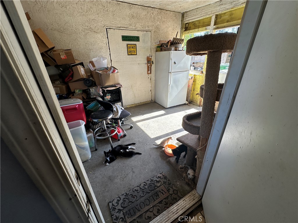 1105 Orange Avenue Chowchilla, CA 93610 - Photo 14 of 41 Breezeway. behind the big door is the shop/garage room.