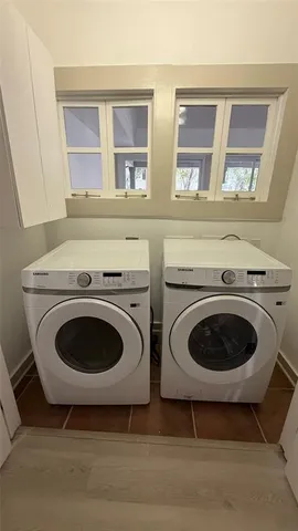a utility room with dryer and washer