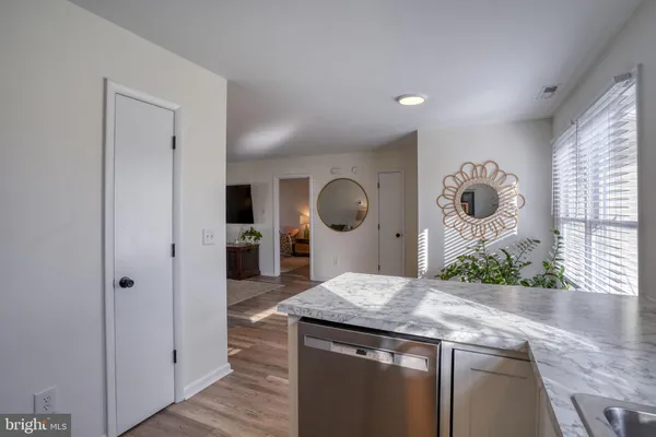 a kitchen with a sink stove and refrigerator