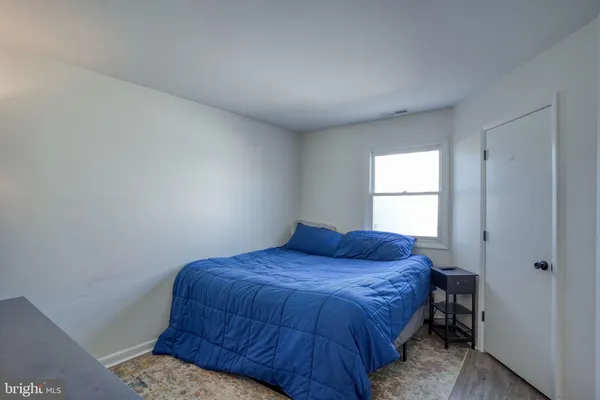 a room that has a closet and bed