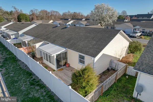 an aerial view of a house with a big yard