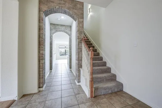 a view of a hallway with entryway