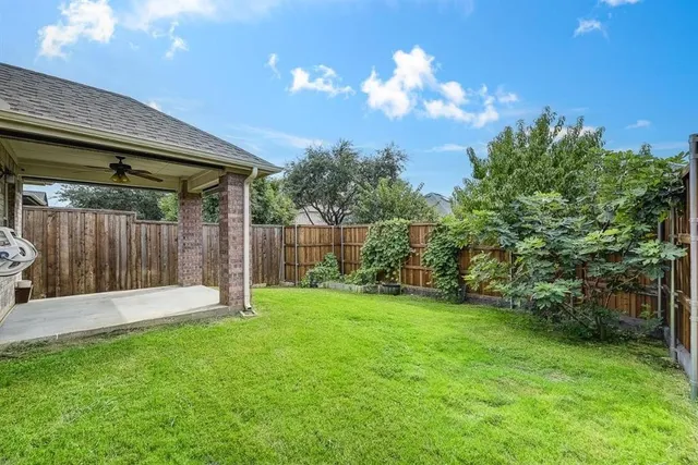 a view of a backyard with a garden