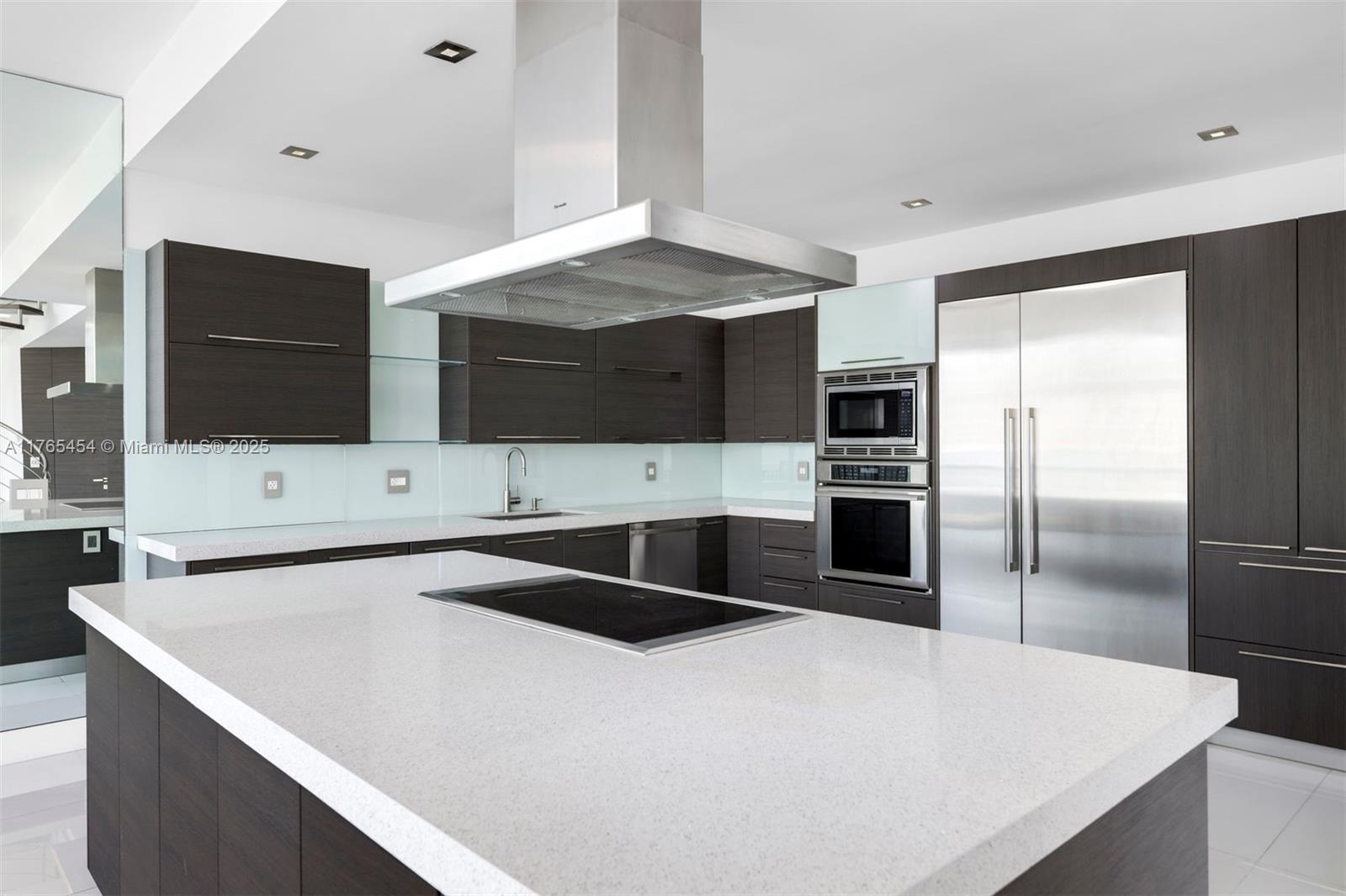 1925 Brickell Avenue, Unit DPH7 Miami, FL 33129 - Photo 24 of 45 a kitchen with stainless steel appliances a refrigerator and a stove