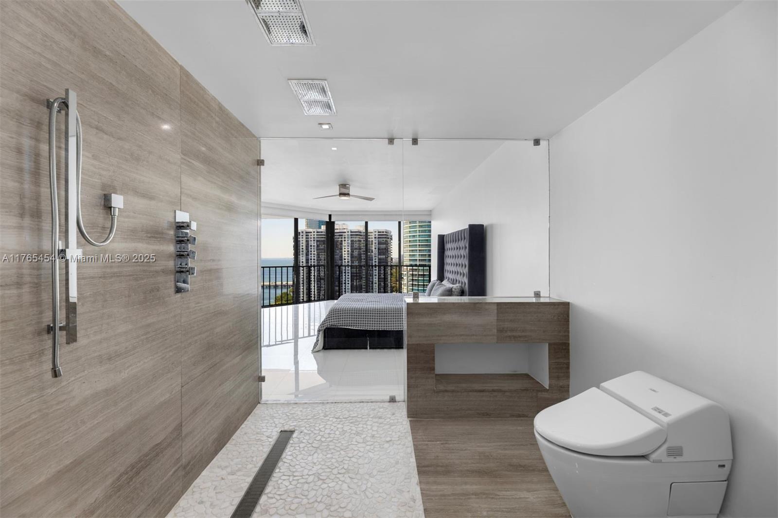 1925 Brickell Avenue, Unit DPH7 Miami, FL 33129 - Photo 35 of 45 a living room with furniture and a large window