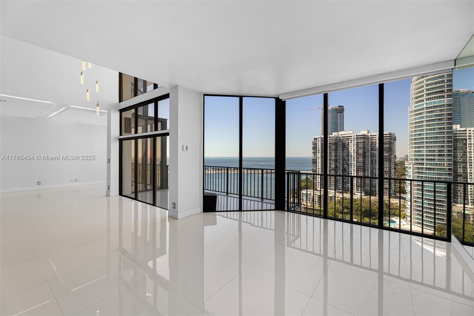 1925 Brickell Avenue, Unit DPH7 Miami, FL 33129 - Photo 4 of 45 a view of staircase with railing and white walls