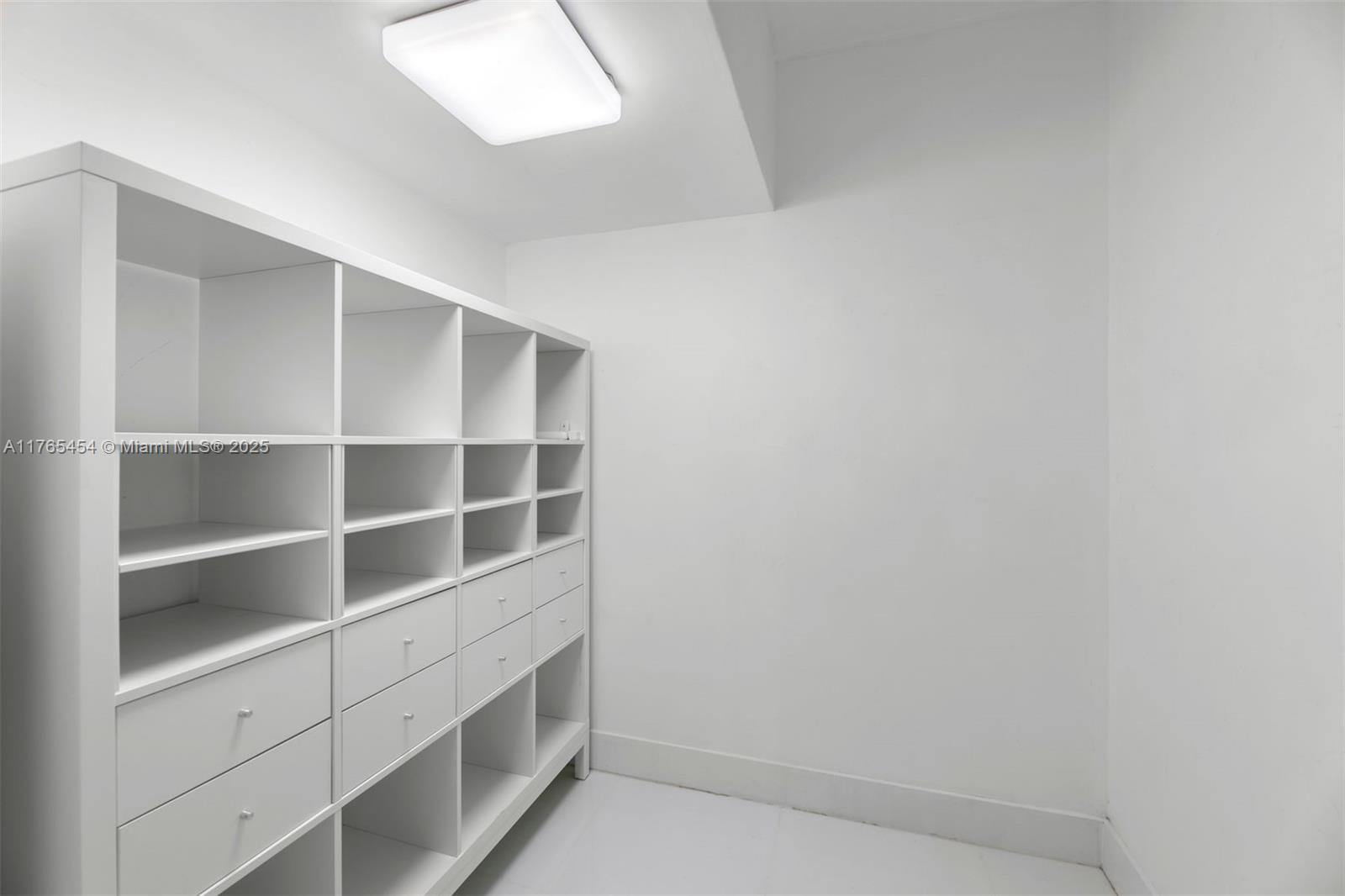 1925 Brickell Avenue, Unit DPH7 Miami, FL 33129 - Photo 43 of 45 a view of an empty walk in closet