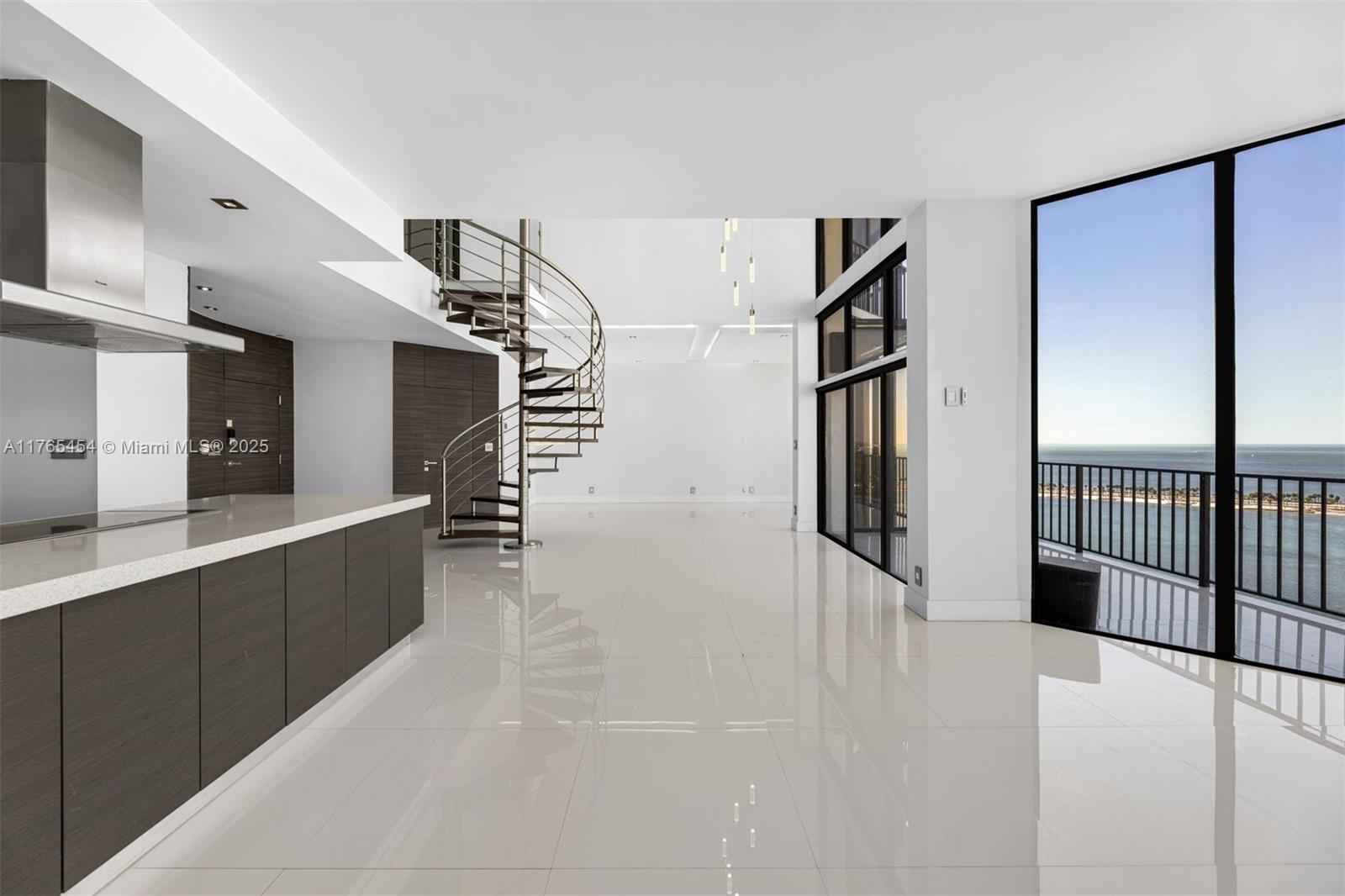 1925 Brickell Avenue, Unit DPH7 Miami, FL 33129 - Photo 8 of 45 a view of a hallway with wooden shelves