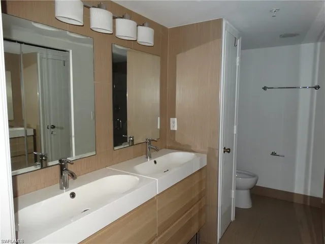 a bathroom with a sink and a large mirror