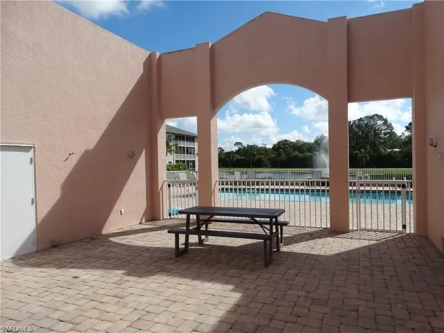 a view of a two chairs in the patio