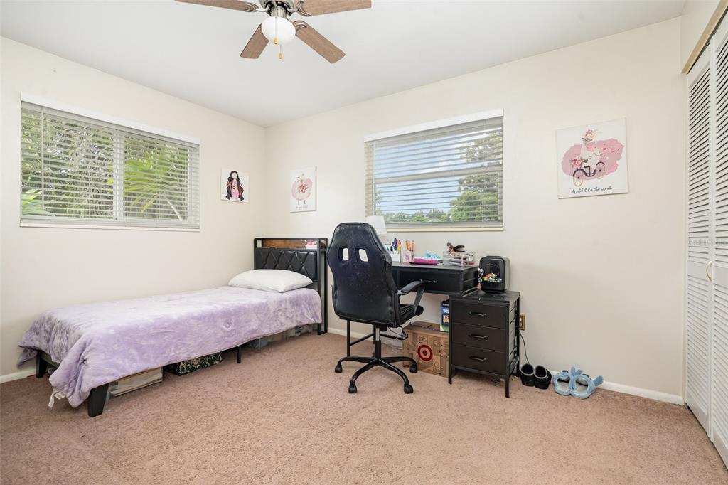 1107 Cable Lane Northeast Palm Bay, FL 32905 - Photo 9 of 17 a bedroom with a workspace