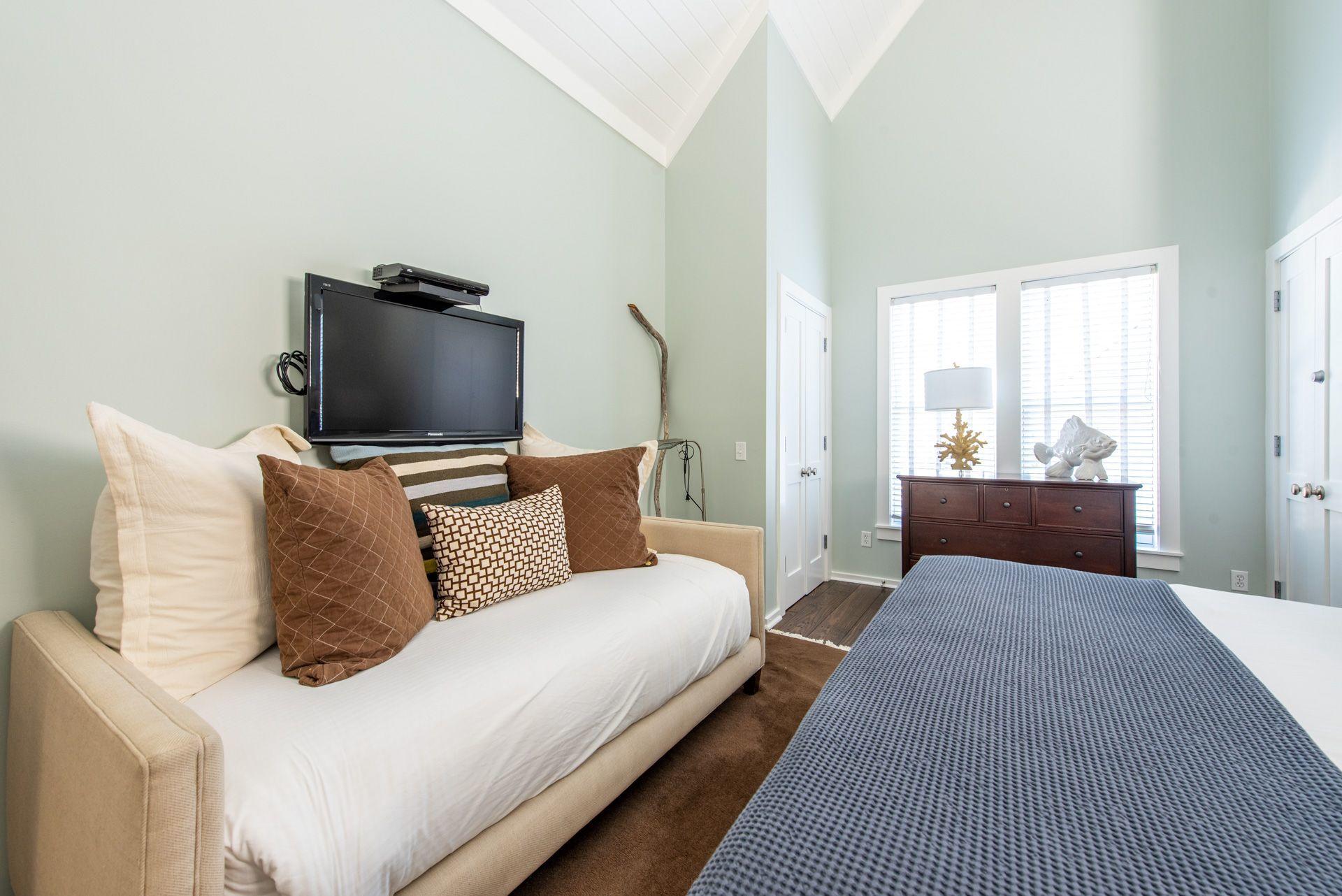 287 Salt Lane Watersound, FL 32461 - Photo 11 of 38 a bedroom with a bed and flat screen tv