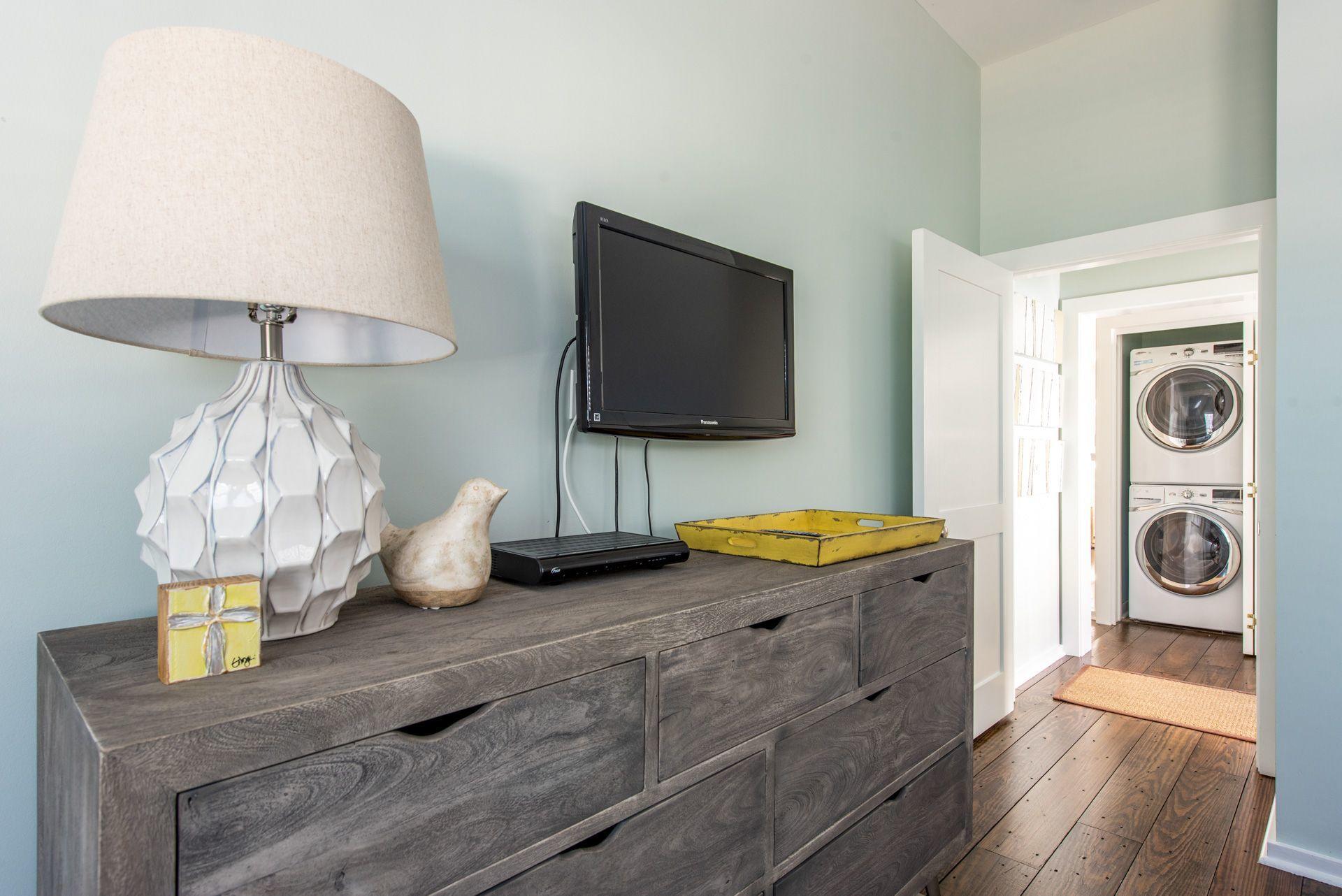 287 Salt Lane Watersound, FL 32461 - Photo 20 of 38 a living room with furniture and a flat screen tv