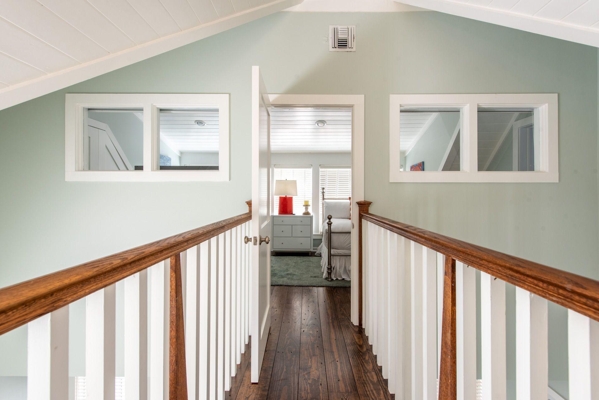 287 Salt Lane Watersound, FL 32461 - Photo 25 of 38 a view of entryway with wooden floor and stairs