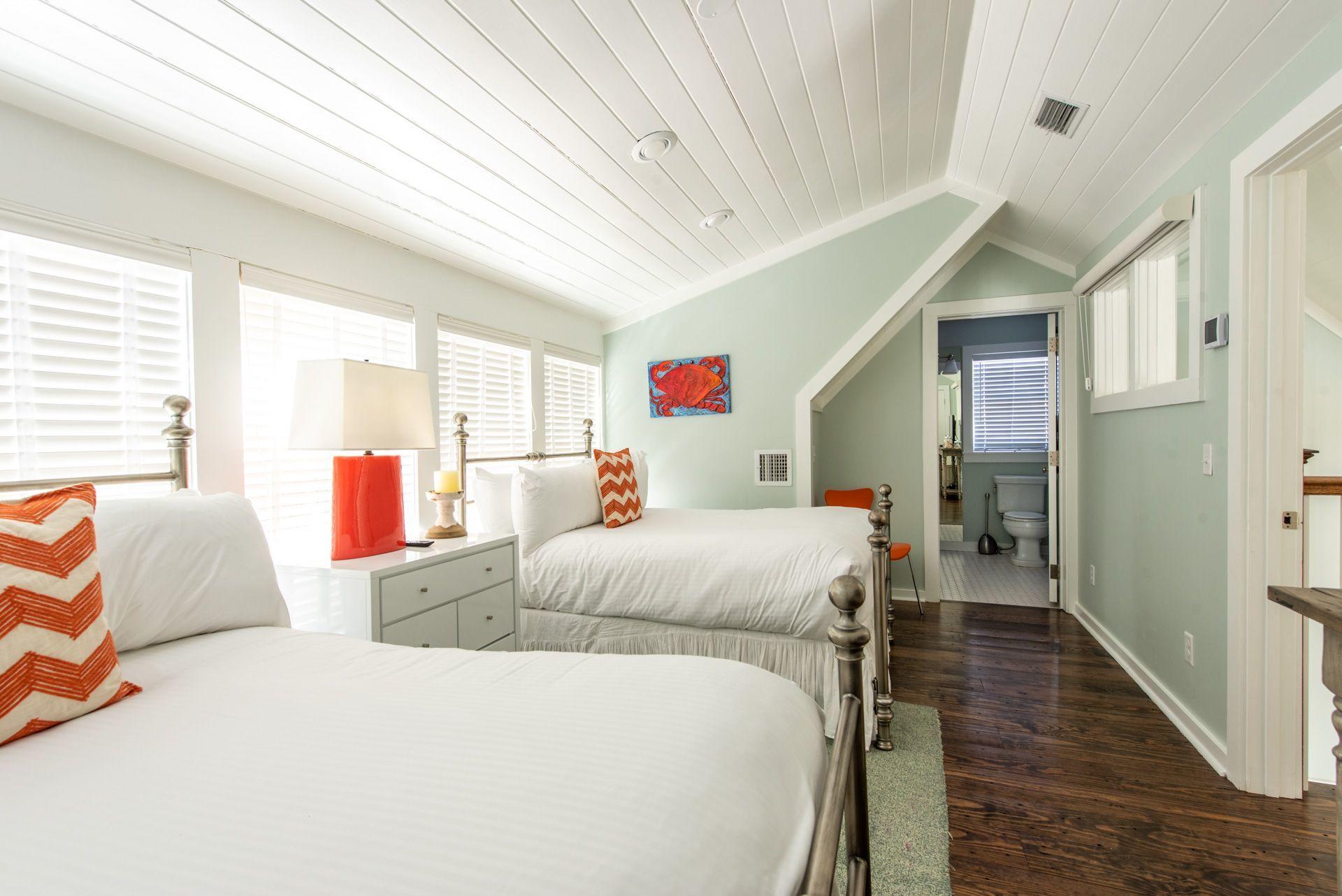 287 Salt Lane Watersound, FL 32461 - Photo 26 of 38 a bed room with a bed and a couch