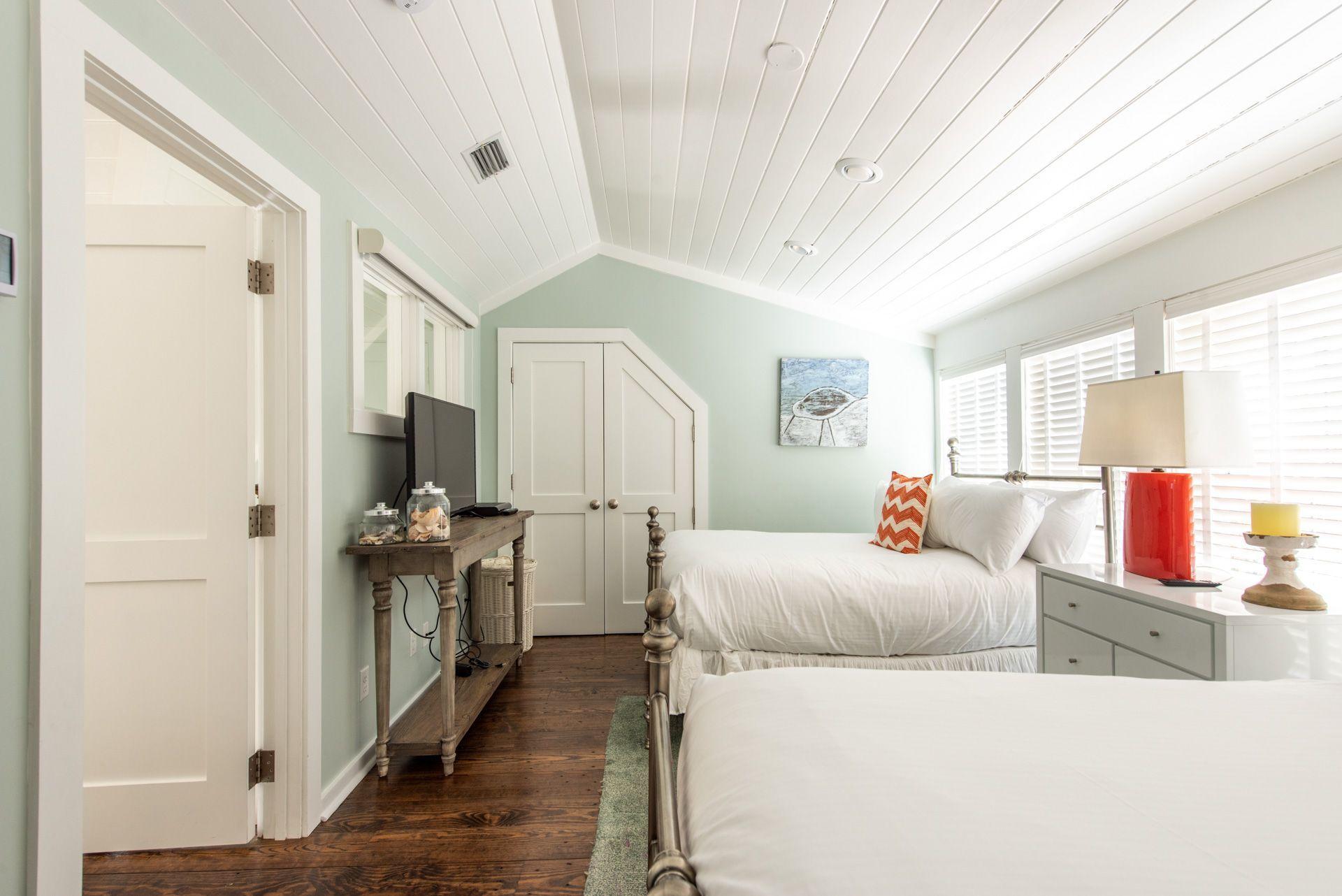287 Salt Lane Watersound, FL 32461 - Photo 27 of 38 a living room with furniture and a flat screen tv