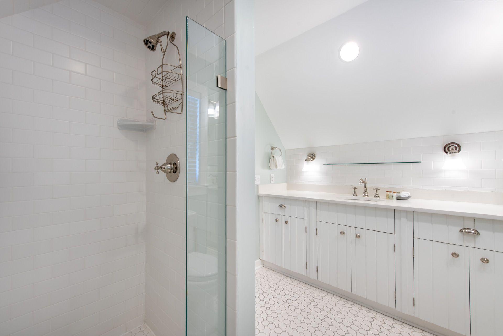 287 Salt Lane Watersound, FL 32461 - Photo 28 of 38 a bathroom with a double vanity sink a mirror and a shower